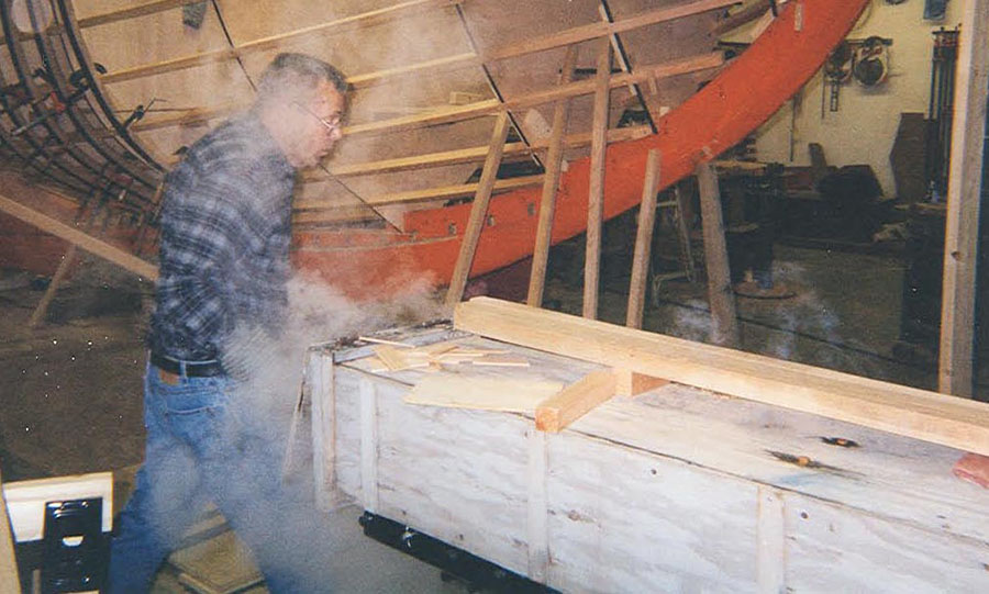 Ted Crosby (1938-2015) works the steam box in the construction of “Katy”.