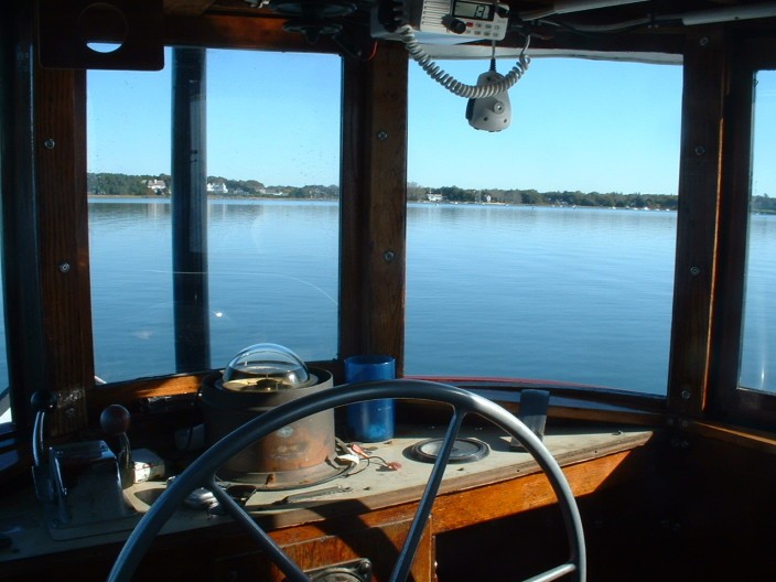 View from the helm of the shop workboat “Admiral” on a quiet, still morning.  E.M.Crosby Boatworks pumps customer’s boats after storms and prepares the boats for weekends.